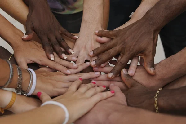 depositphotos_15549477-stock-photo-many-hands-together-group-of